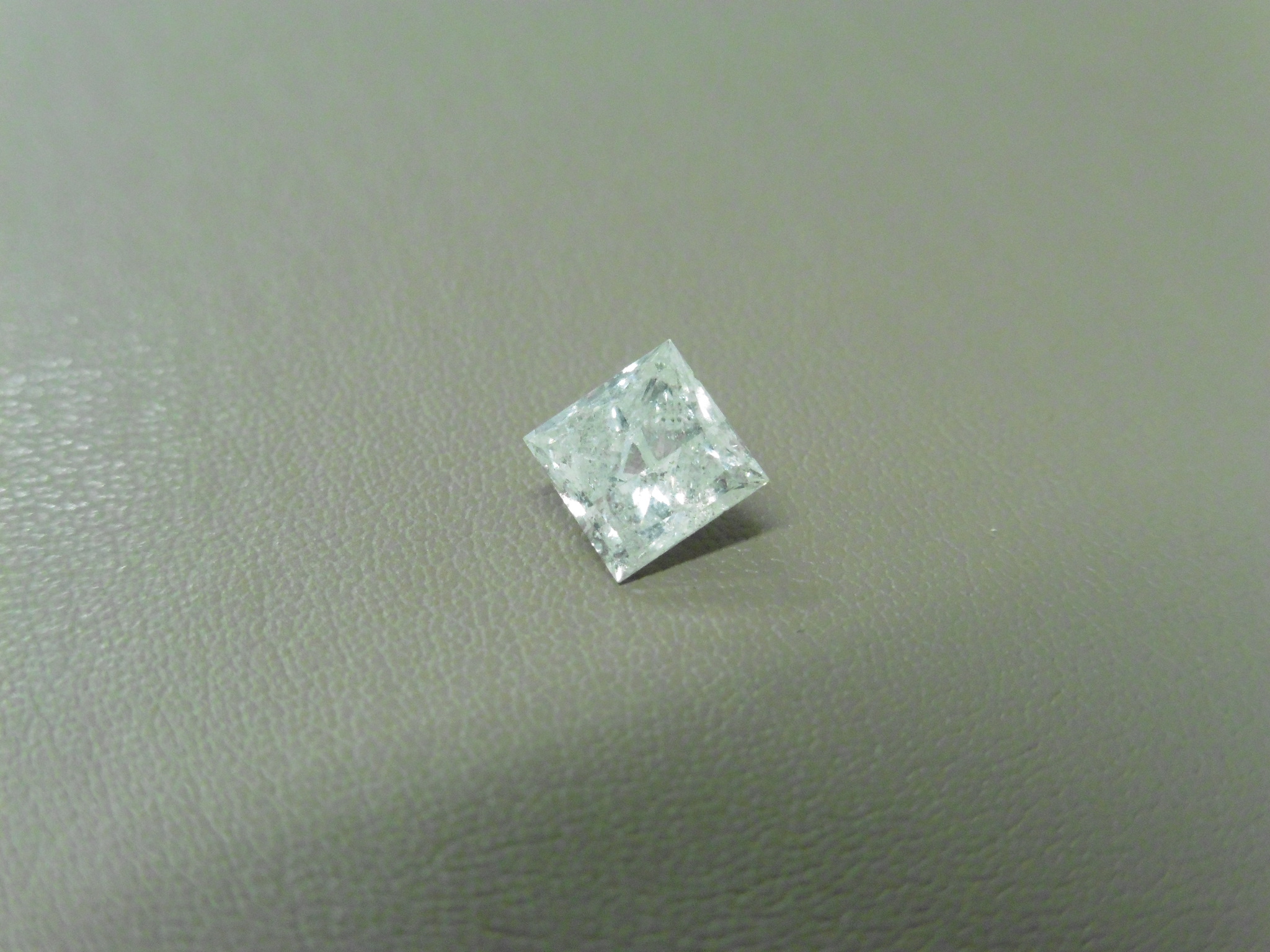 1.01ct enhanced princess cut diamond. H/I colour and I2 clarity. No certification but can be done