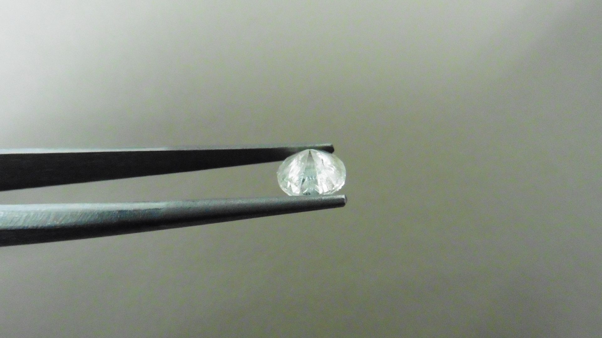 1.02ct Brilliant Cut Diamond, Enhanced stone. I colour, I2 clarity. 6.34 x 3.93mm. Valued at £ - Image 2 of 4