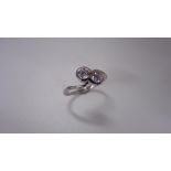 1ct two stone twist ring set in platinum. Brilliant cut diamonds, I/J colour, si2 clarity weighing