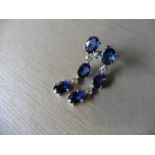 4.80ct sapphire and diamond drop earrings set in platinum. Each set with 3 oval cut sapphires (