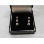 1.20ct trilogy drop earrings set in platinum. 3 graduated brilliant cut diamonds, I colour, Si2-3