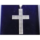 A diamond set cross pendant on chain