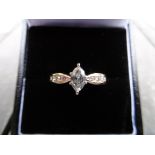 14ct Gold Marquise cut Diamond ring. 0.48ct plus 4 small round cut Diamonds on each shoulder