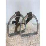 A pair of antique horse stirrups