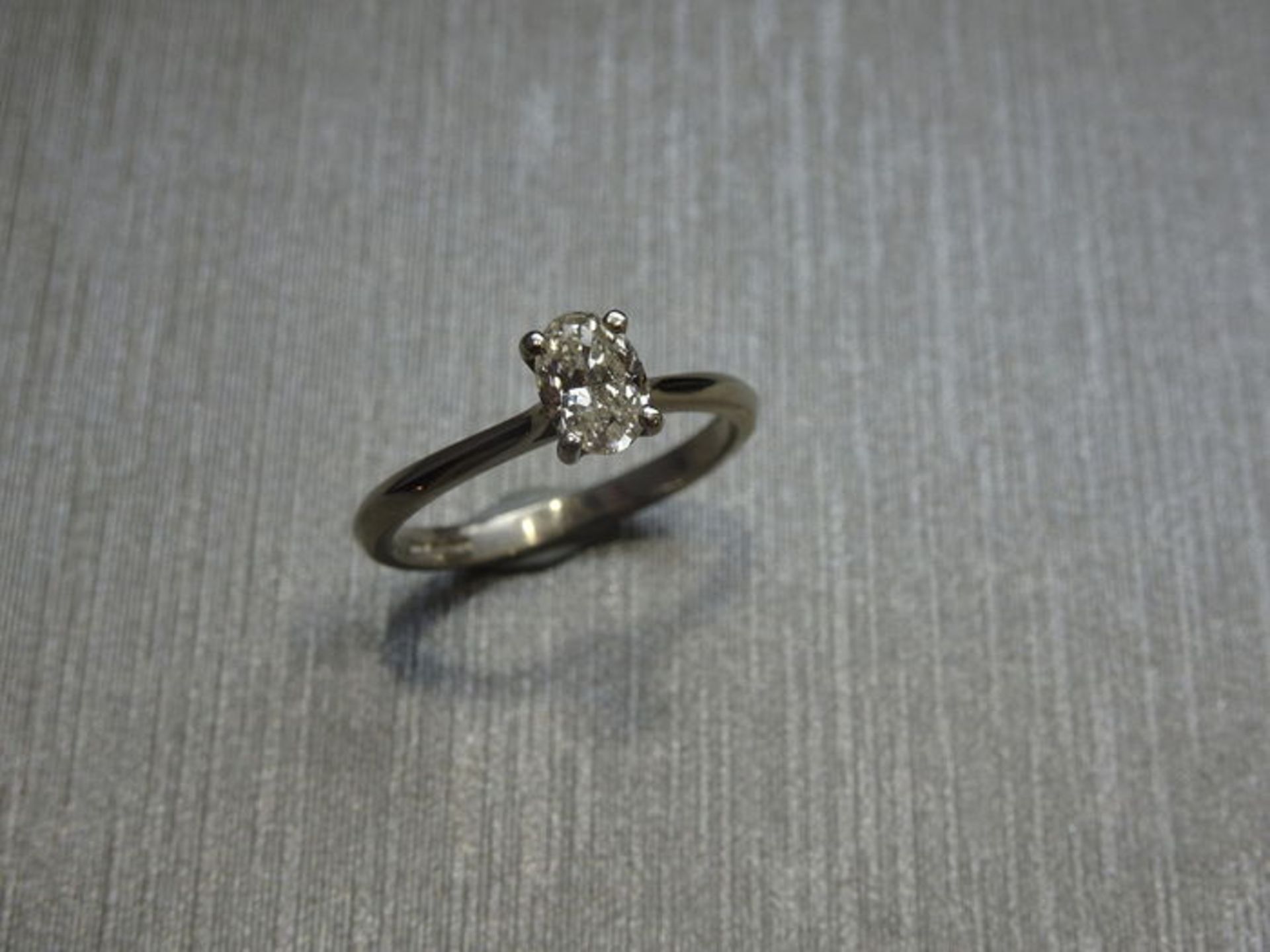 0.60ct diamond solitaire ring with a oval cut diamond. I colour and si2 clarity. Set in 18ct gold