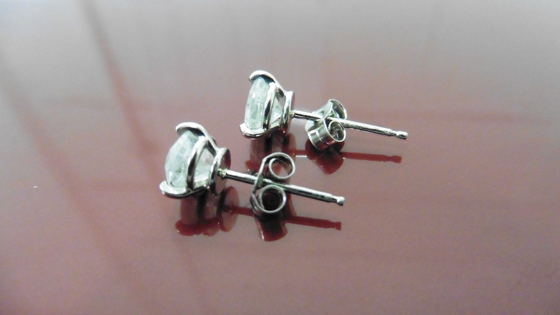 2.00ct Solitaire diamond stud earrings set with brilliant cut diamonds which have been enhanced. I - Image 2 of 2