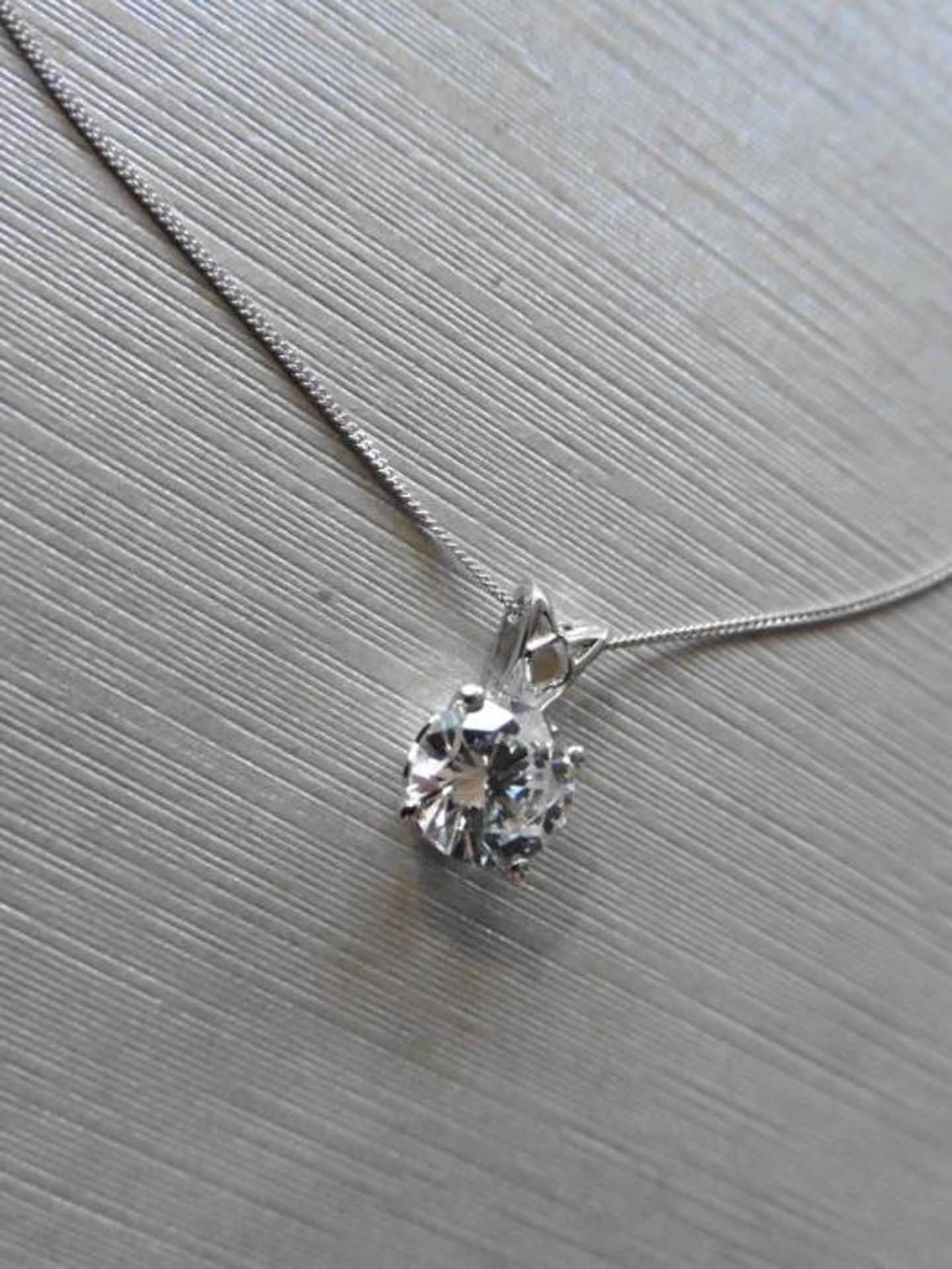 1.00ct diamond pendant set in platinum. H colour and I1 clarity. 4 claw setting with open bale and