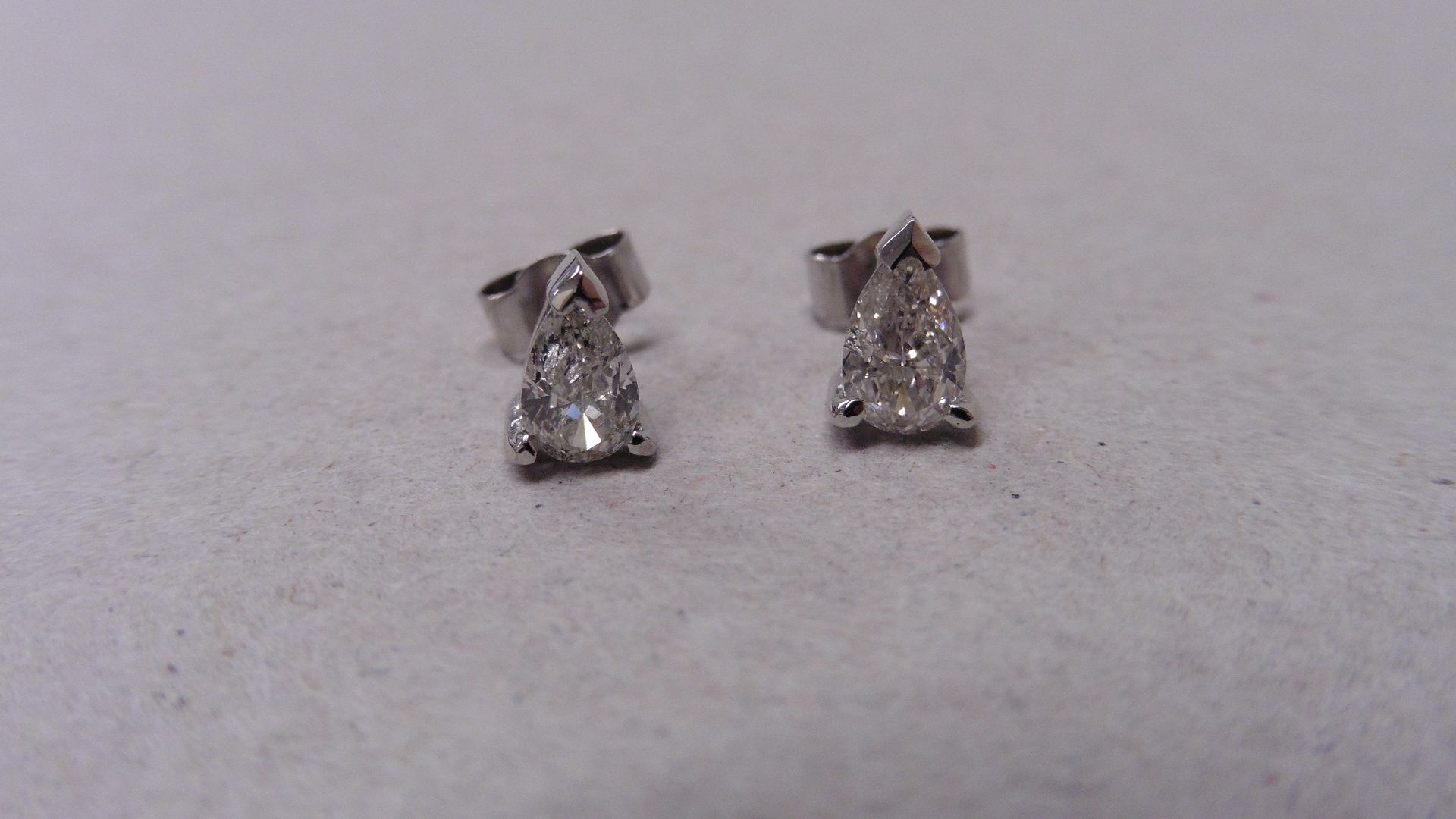 0.70ct diamond earrings with pear diamonds. H/Icolour and si2 clarity. Set in 18ct white gold with