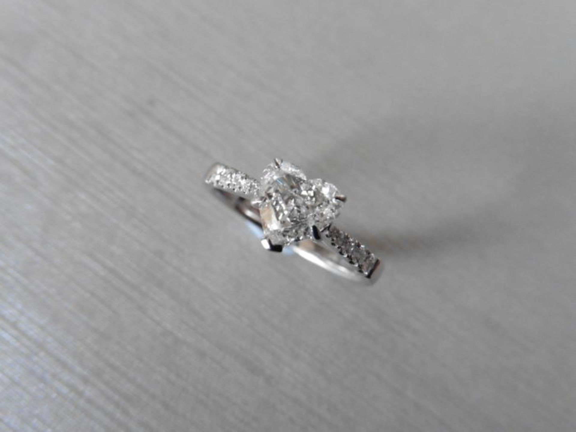 0.91ct diamond set solitaire ring set in 18ct white gold. Heart shaped diamond, I colour and Si2