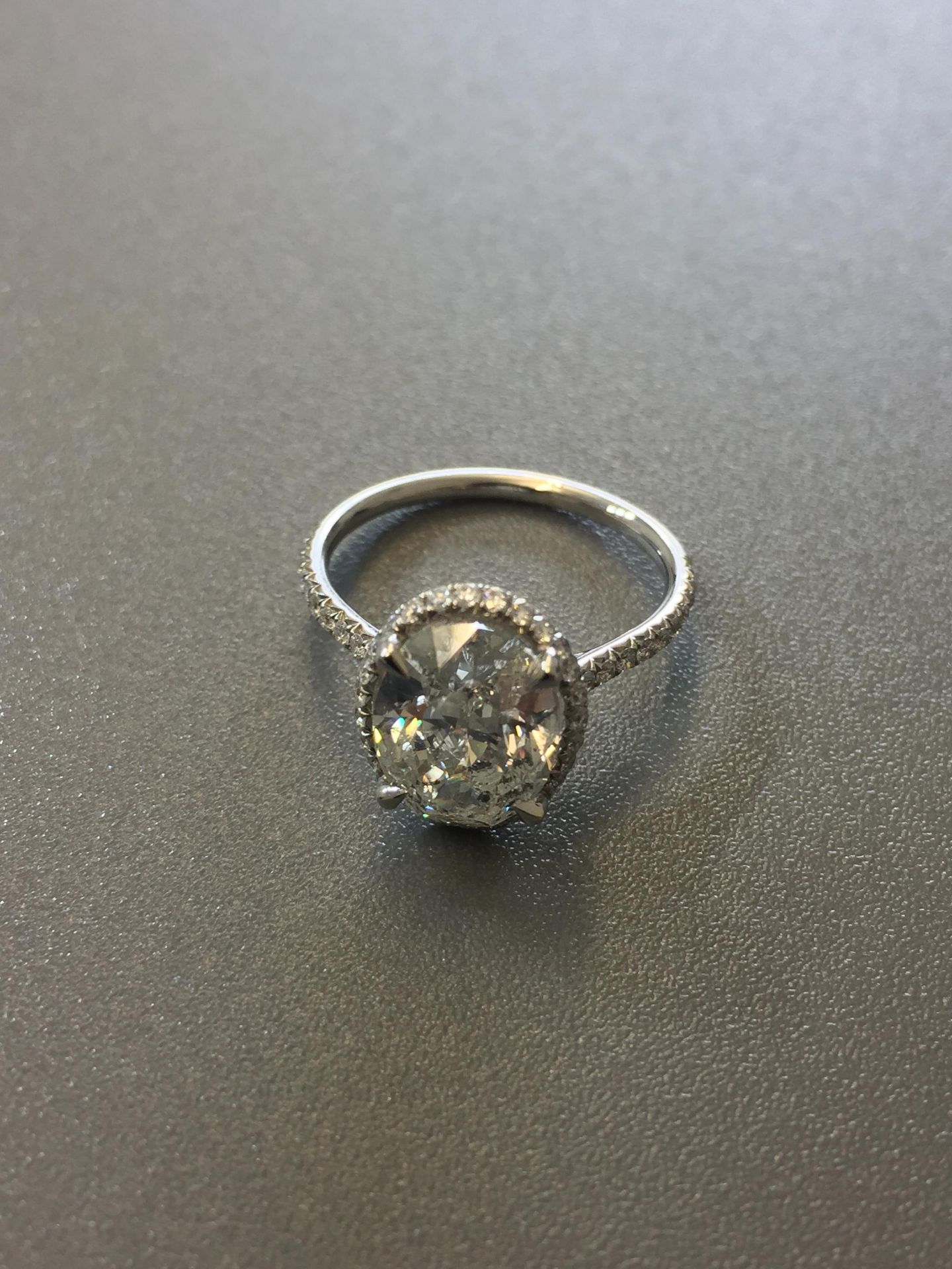 3.01ct diamond set solitaire ring. Oval cut diamond H colour si2 clarity in the centre with a halo - Image 3 of 5