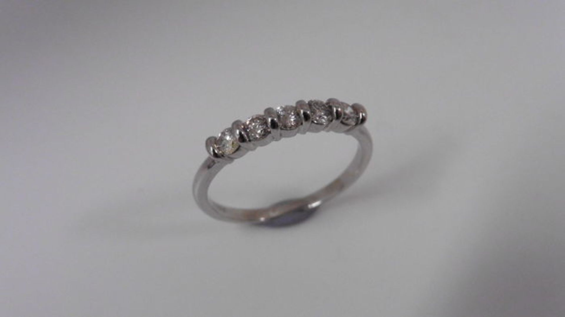 0.50ct diamond five stone ring set platinum. I colour and si3 clarity. Bar setting with brilliant