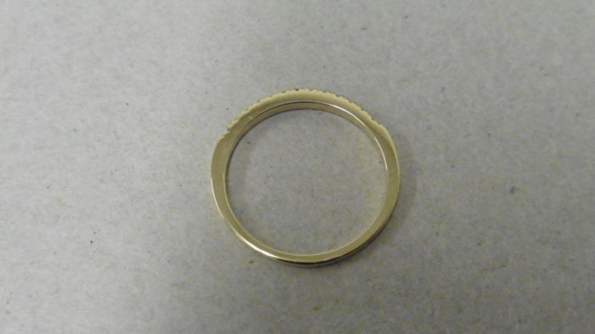 0.13ct diamond band ring set in 14ct yellow gold. Small brilliant cut diamonds, I colour and i1 - Image 3 of 3