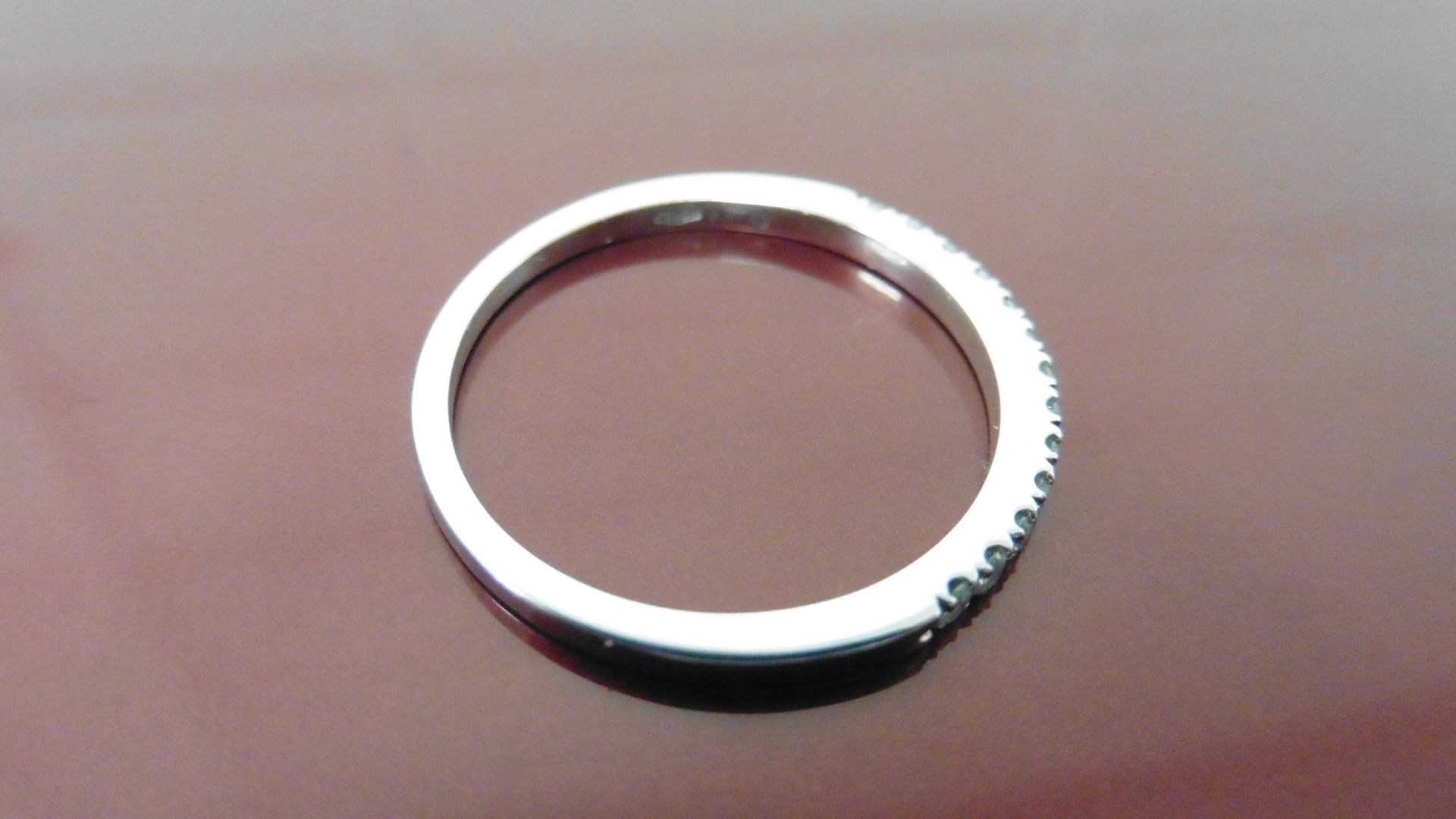 0.13ct diamond band ring set in 14ct white gold. Small brilliant cut diamonds, I colour and i1 - Image 2 of 2