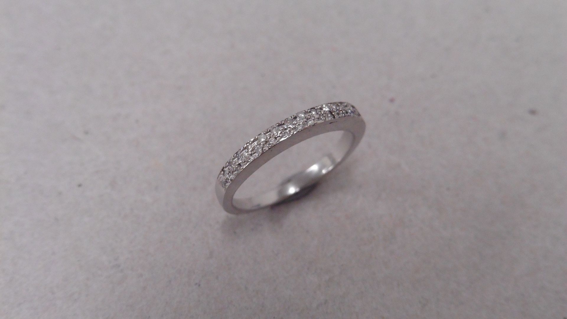 18ct gold diamond set band ring. Small brilliant cut diamonds H-J colour and si3-i1 clarity. Micro