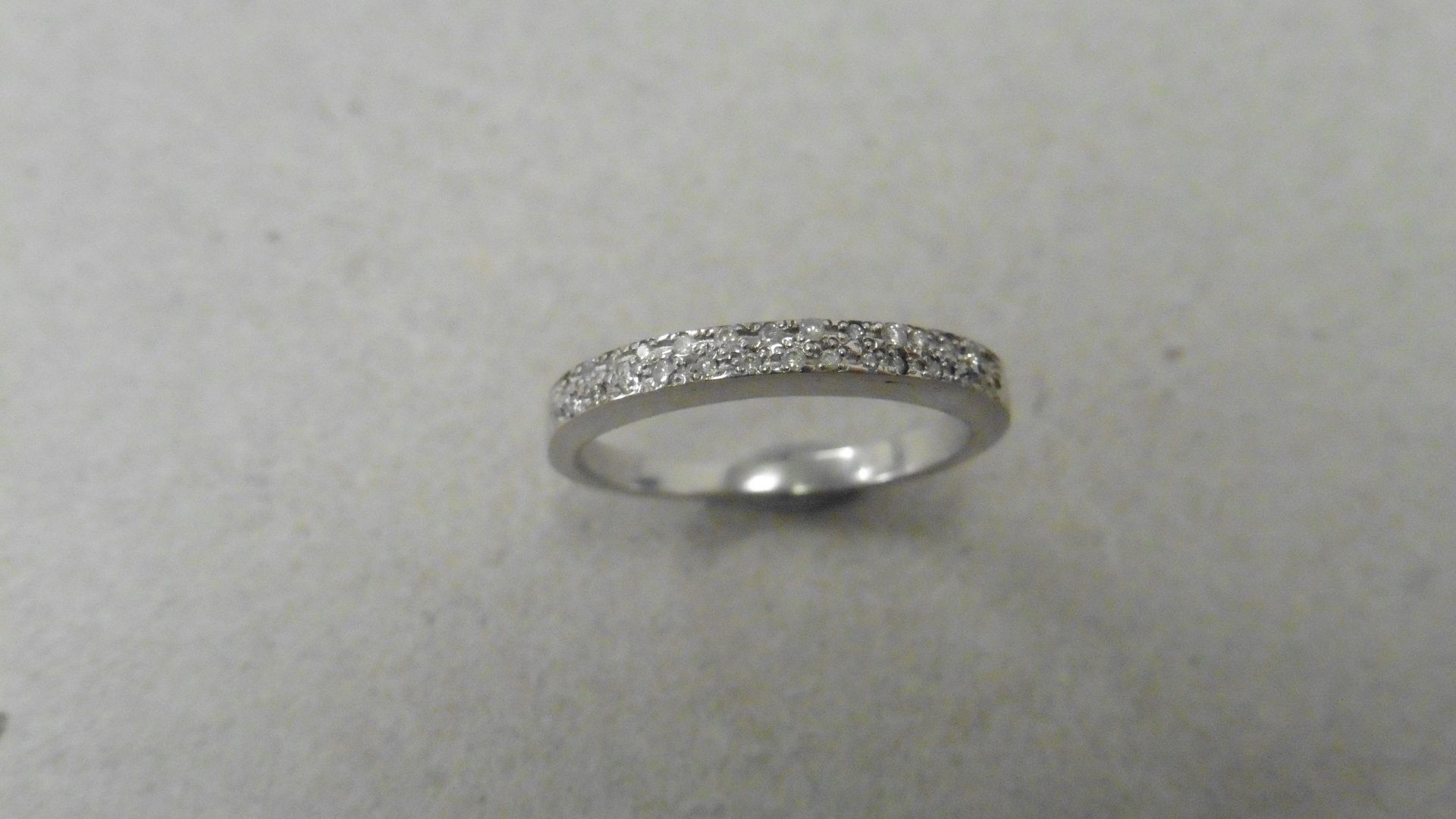 18ct gold diamond set band ring. Small brilliant cut diamonds H-J colour and si3-i1 clarity. Micro - Image 2 of 4