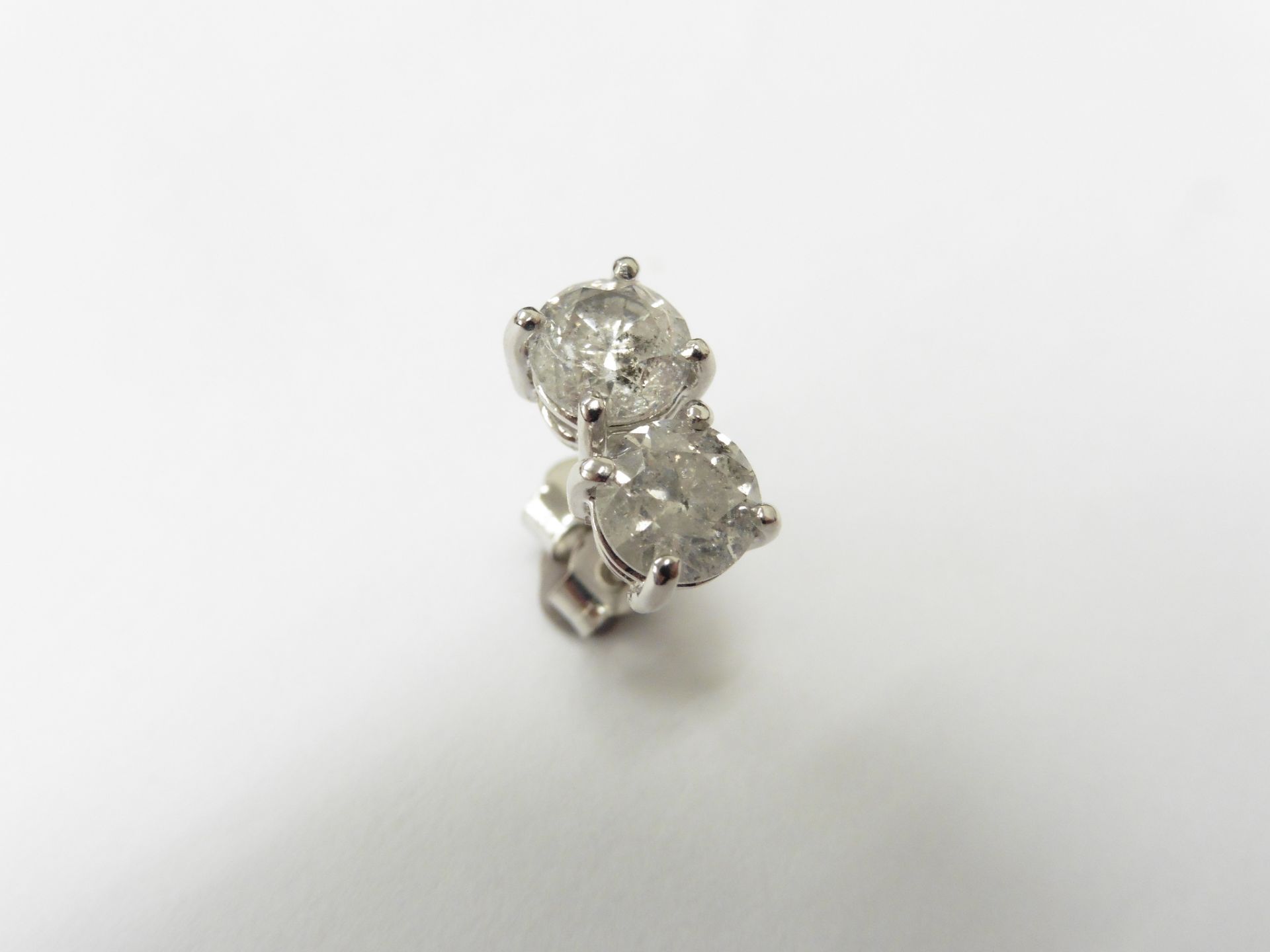 2.00ct Solitaire diamond stud earrings set with brilliant cut diamonds which have been enhanced. I