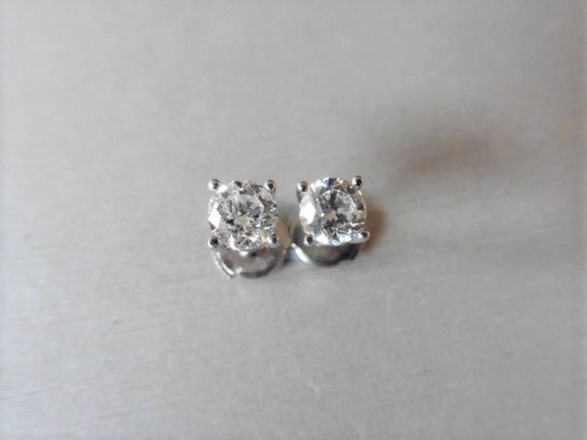 1.50ct diamond solitaire earrings set in 18ct white gold. 2 x brilliant cut diamonds, I colour and