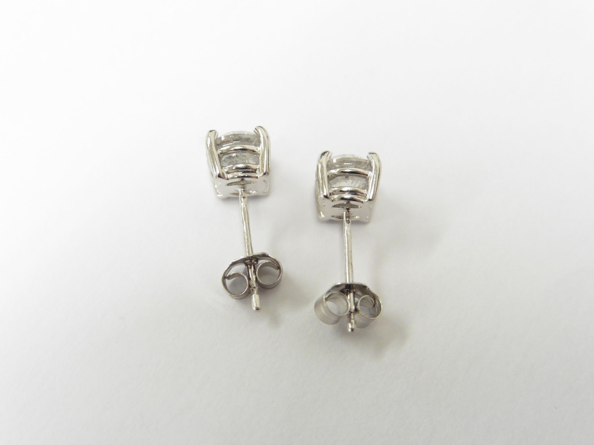 2.00ct Solitaire diamond stud earrings set with brilliant cut diamonds which have been enhanced. I - Image 2 of 2