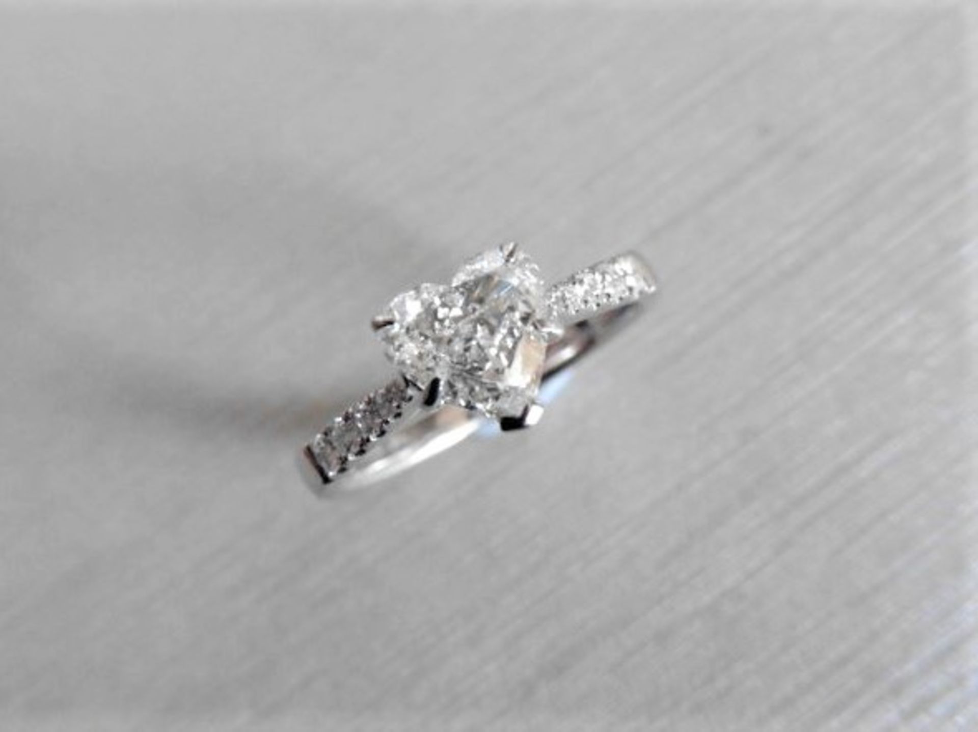 0.91ct diamond set solitaire ring set in 18ct white gold. Heart shaped diamond, I colour and Si2