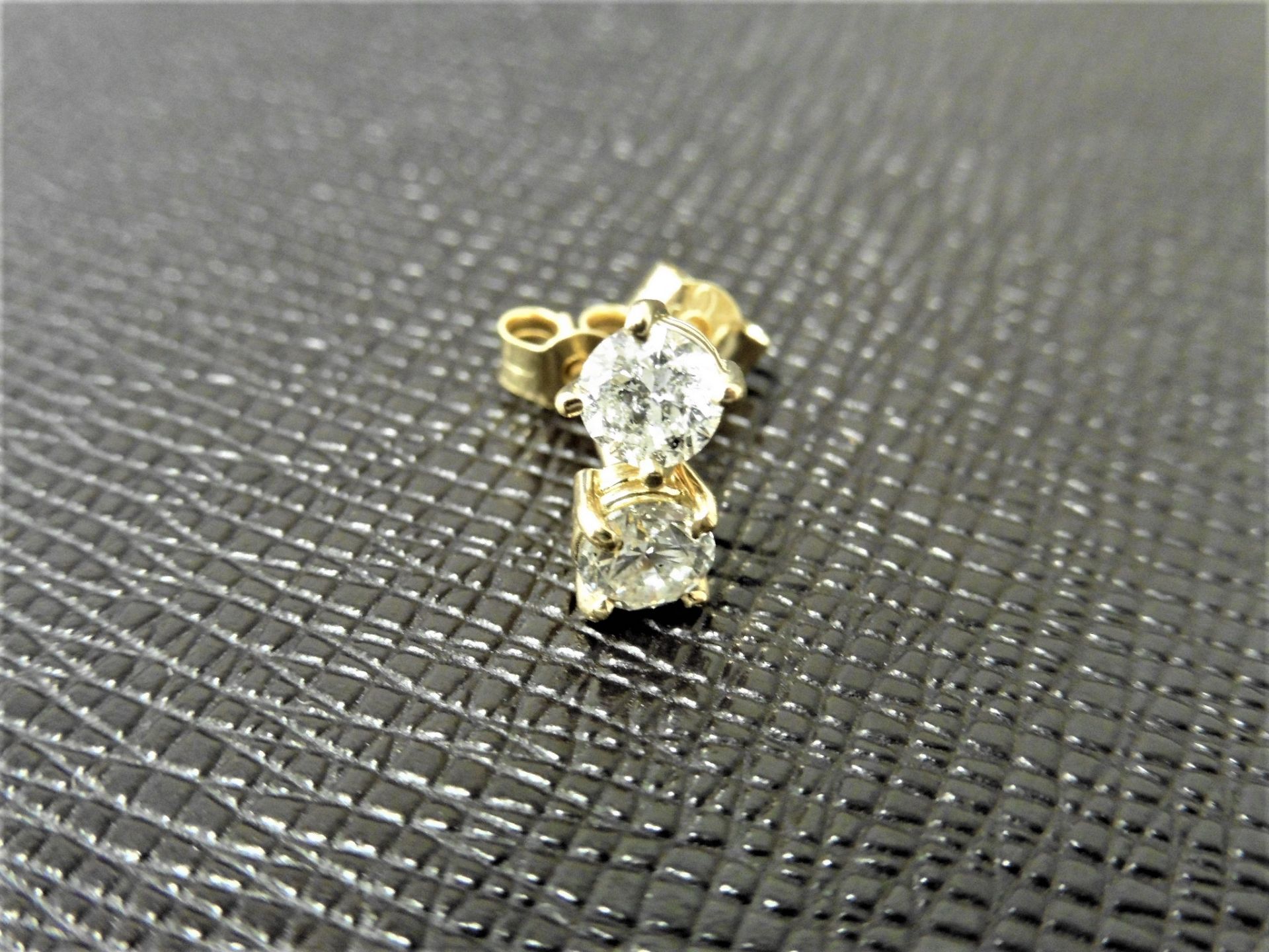 1.00ct diamond solitaire earrings set in 18ct yellow gold. 2 x brilliant cut diamonds, 0.50ct (