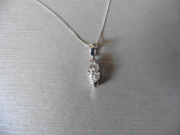 0.45ct diamond pendant with a marquise diamond. H colour and si1 clarity. 2 claw setting with