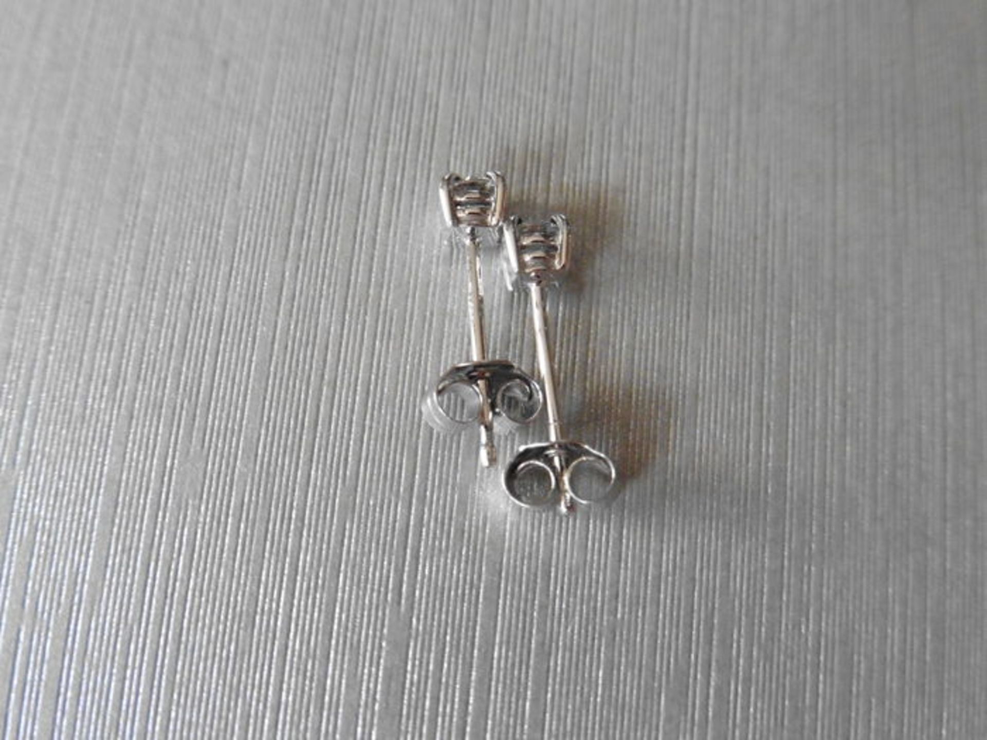 0.50ct diamond solitaire stud earrings set in platinum. I/J colour, si2 clarity.4 claw setting - Image 2 of 2