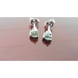 0.70ct diamond solitaire stud earrings set in platinum. I colour, si3 clarity. 3 claw setting with