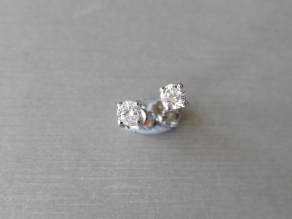 0.25ct diamond solitaire stud earrings set in platinum. I colour, si3 clarity.4 claw setting with