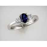 A Three Stone Sapphire and Diamond Ring