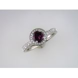 A Diamond and Rhodolite Halo Ring