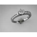 Solitaire Diamond Ring with Shoulder Diamonds