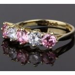 9CT GOLD PINK AND PURPLE CUBIC ZIRCONIA FIVE STONE RING