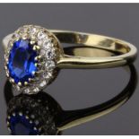 9CT GOLD HALO RING, COMPRISING A CENTRE OVAL SHAP