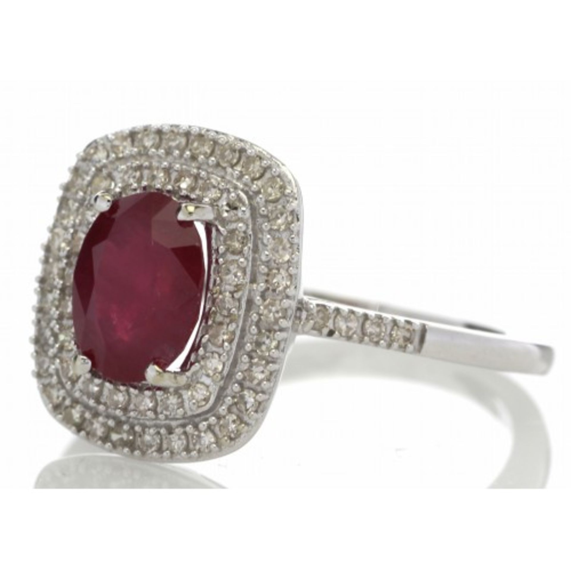 Ruby and diamond cluster dress ring set in 14ct gold. 1.54ct Oval cut ruby surrounded with a - Image 2 of 5