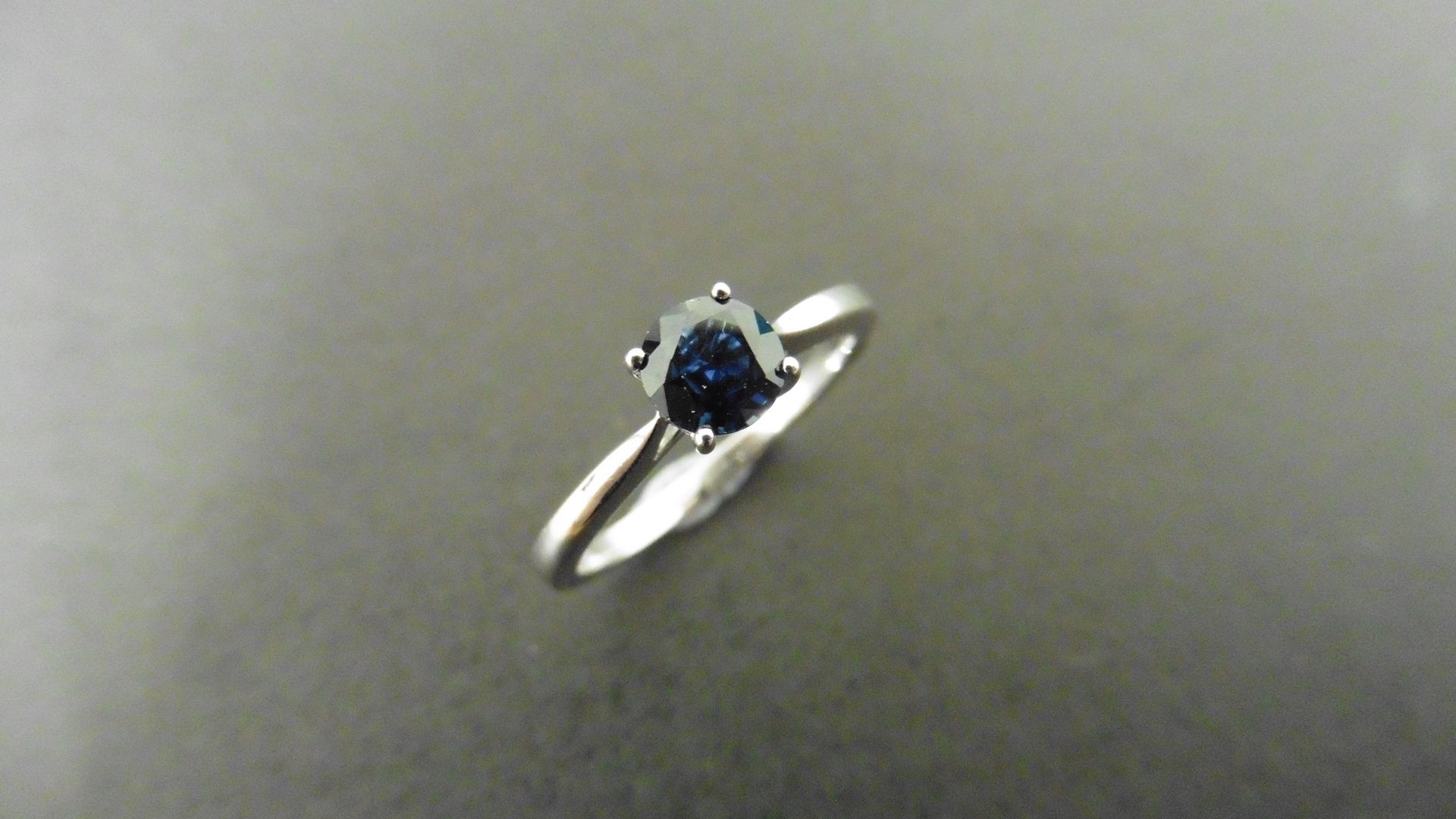 0.50ct solitaire style ring set with a round cut sapphire ( treated ) 5mm. Set in platinum with 4 - Image 4 of 4