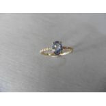 0.80ct / 0.12ct ceylon sapphire and diamond dress ring. Oval cut ( treated ) sapphire with small