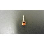 0.80ct citrine and diamond drop style pendant. 7X 5mm oval citrine set with 5 small brilliant cut