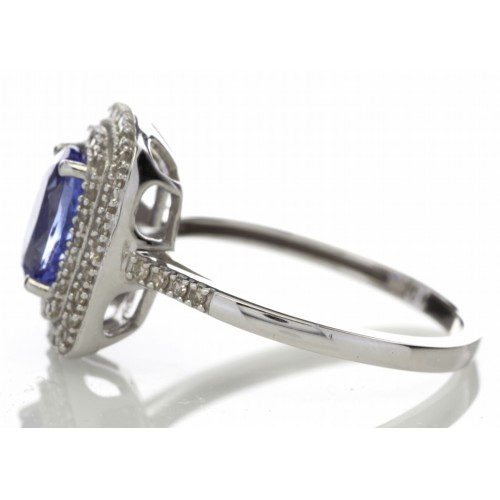 Tanzanite and diamond cluster dress ring set in 14ct gold. 1.29ct Oval cut tanzanite surrounded with - Image 2 of 5