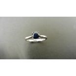 0.50ct solitaire style ring set with a round cut sapphire ( treated ) 5mm. Set in platinum with 4