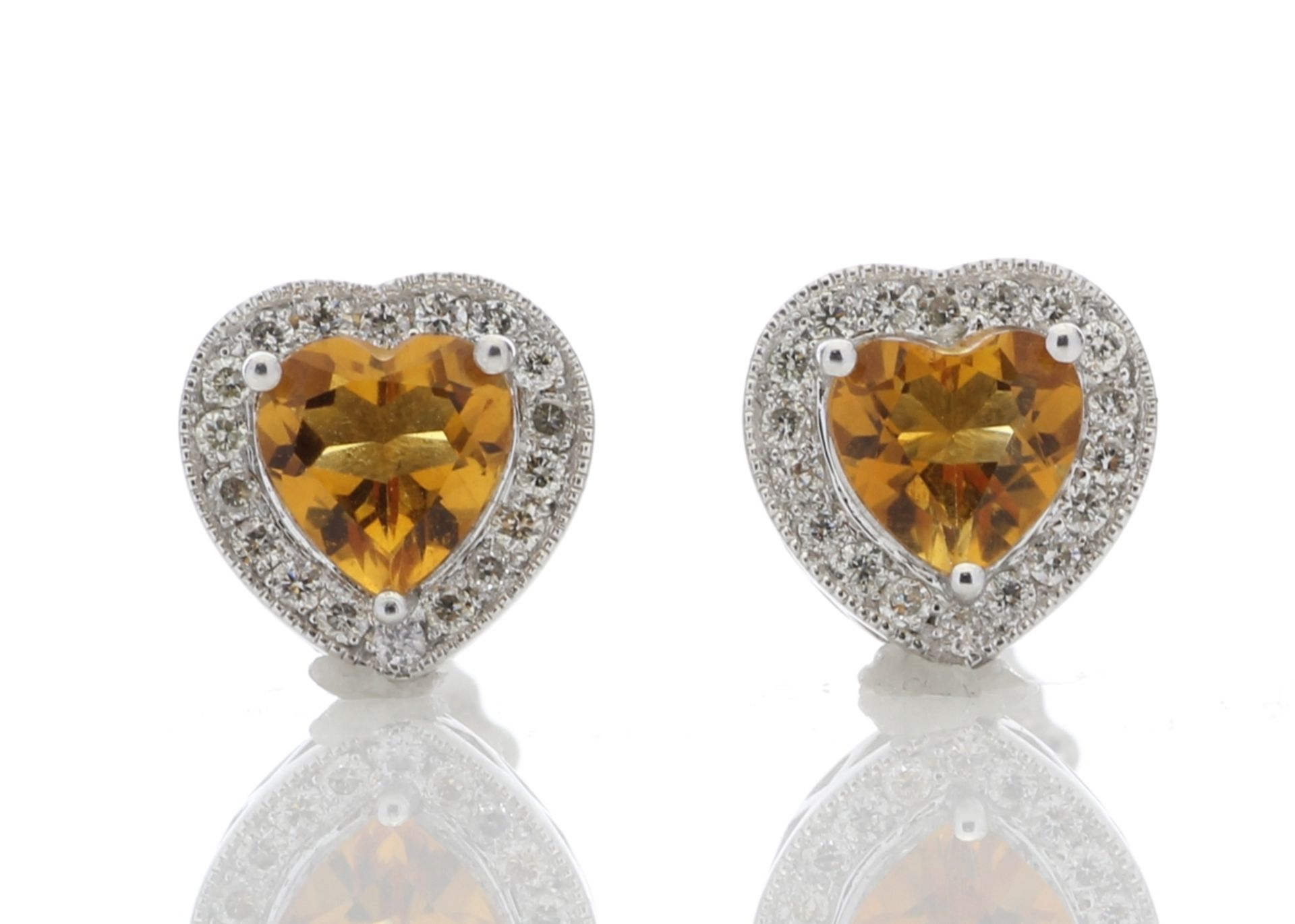 Citrine and diamond heart shaped stud earrings set in 9ct gold. 0.18ct weight. G colour and Si
