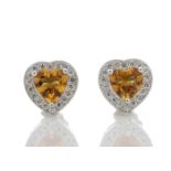 Citrine and diamond heart shaped stud earrings set in 9ct gold. 0.18ct weight. G colour and Si