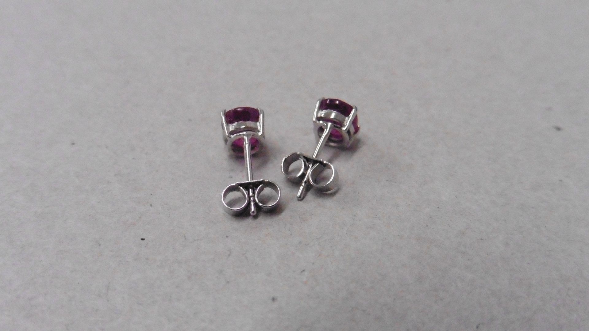 1.60ct ruby stud style earrings set in 9ct white gold. 7 x 5mm oval cut rubies ( glass filled ) - Image 2 of 2