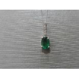 0.80ct emerald and diamond drop style pendant. 7X 5mm oval emerald set with 5 small brilliant cut
