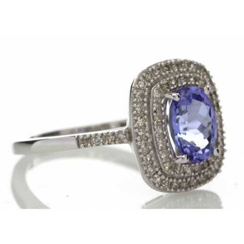 Tanzanite and diamond cluster dress ring set in 14ct gold. 1.29ct Oval cut tanzanite surrounded with - Image 4 of 5