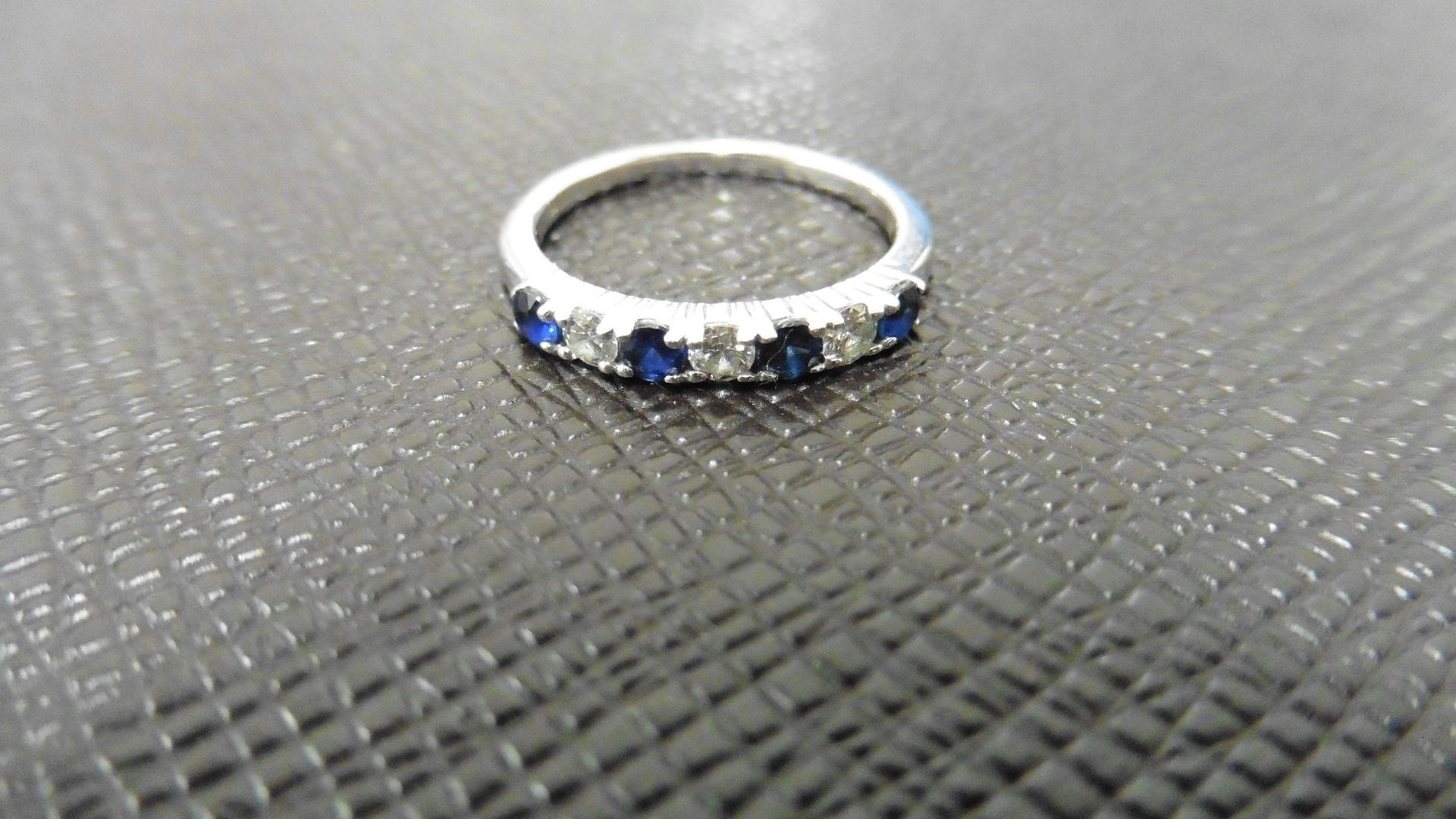 0.40ct sapphire and diamond eternity style ring. Set with 4 round cut sapphires and 3 diamonds. Size - Image 2 of 3