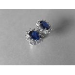 1.60ct Sapphire and Diamond cluster style stud earrings. Each Sapphire ( glass filled ) measures 7mm