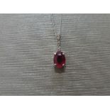 0.80ct Ruby and diamond drop style pendant. 7X 5mm oval ruby set with 5 small brilliant cut