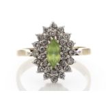 Peridot and diamond cluster style ring in 9ct gold. Oval cut peridot surrounded with brilliant cut