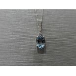 0.80ct tanzanite and diamond drop style pendant. 7X 5mm oval tanzanite set with 5 small brilliant