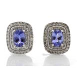 0.80ct tanzanite and diamond cluster stud earrings. 2 oval cut tanzanites surrounded with